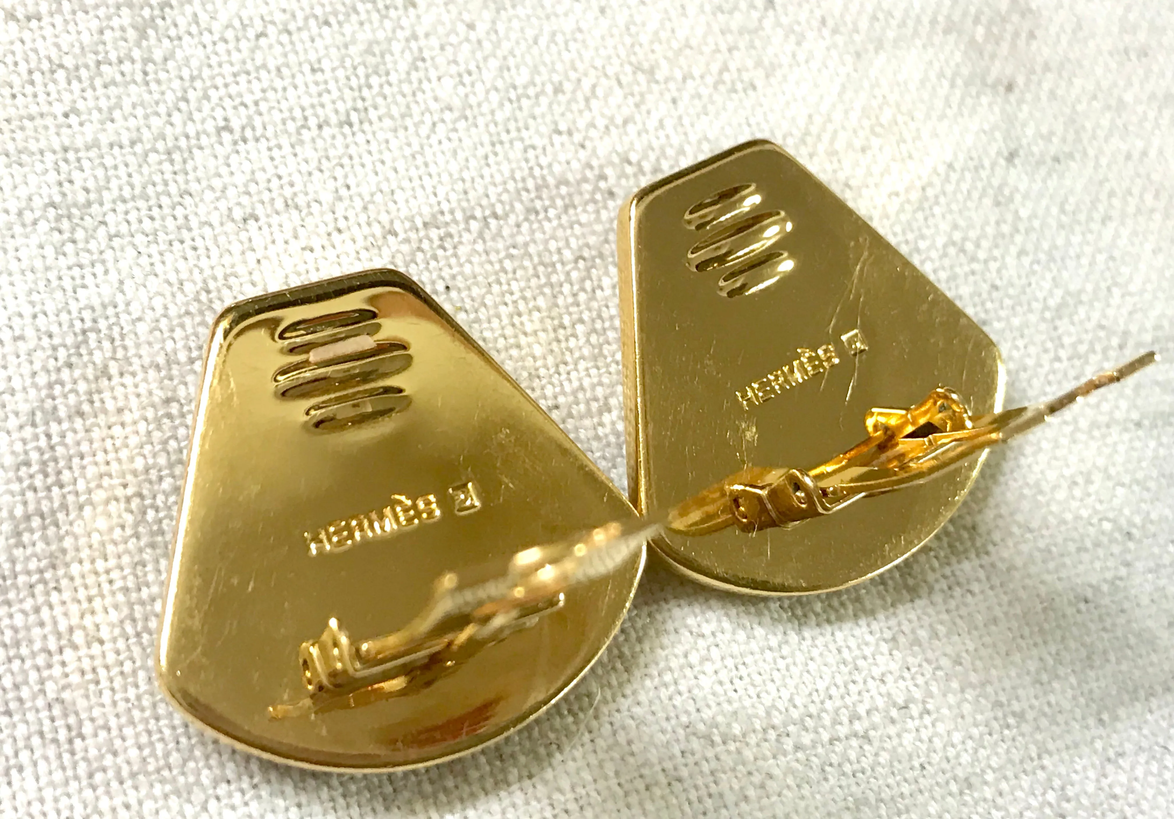 Vintage Hermes cloisonne golden earrings with black and yellow chain, stud, H logo, mademoiselle design. Fan shape enamel classic jewelry.